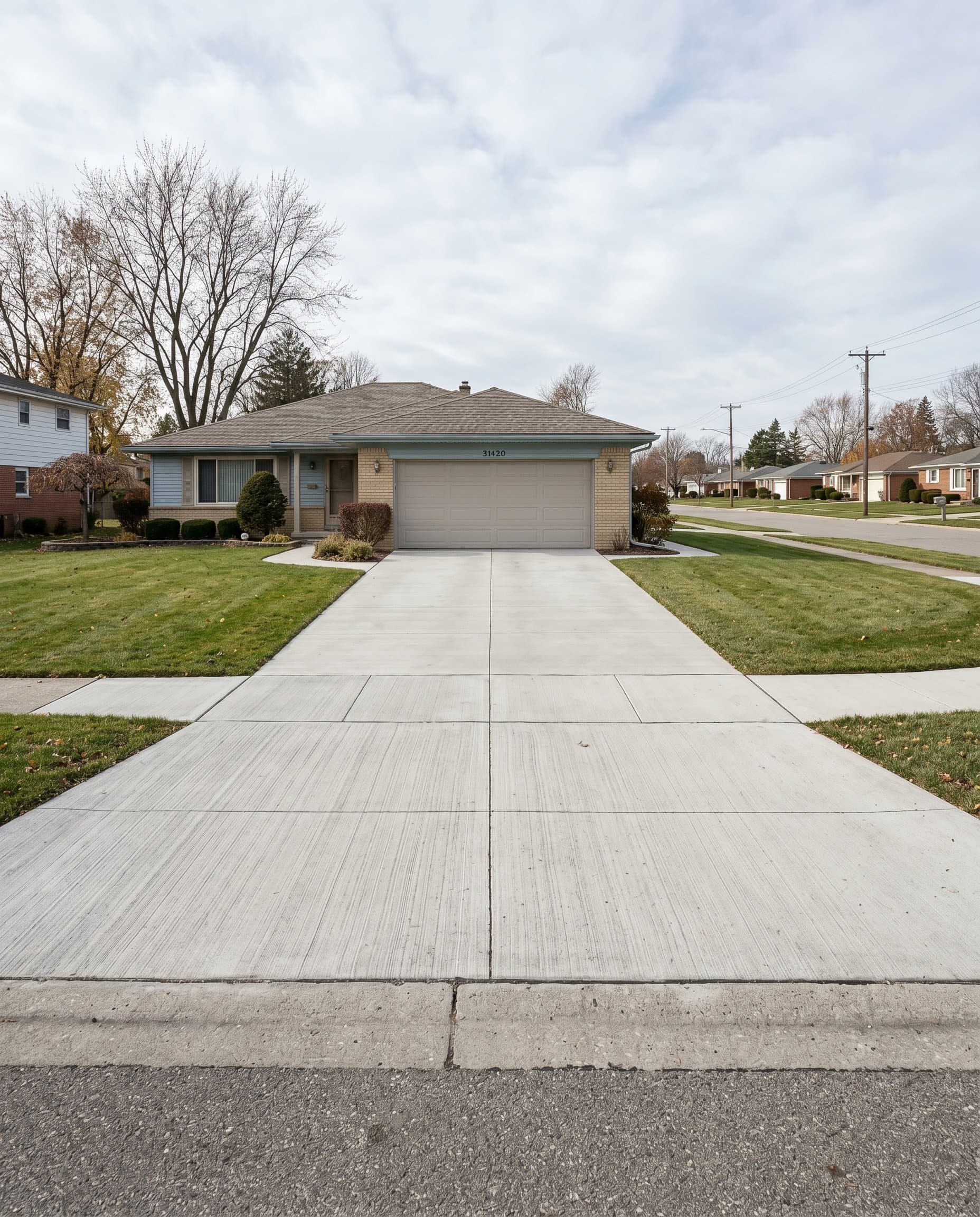 Finished concrete driveway with a broom finish in Sterling Heights, MI.
